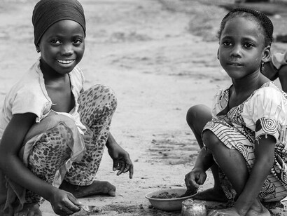Child laborers in Africa smiling despite their situation