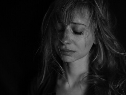 Woman exhausted from shame and emotional overwhelm