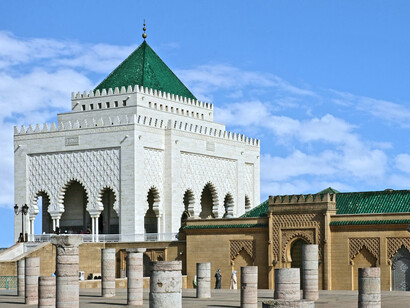 The Mausoleum of Mohammed V, reflecting Moroccan craftsmanship with its white marble walls and green-tiled roof built in 1971