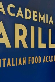 Enrico Di Carlo holding his book "Il Brindisi del Poeta Astemio." Photo courtesy of Ennio Barbieri