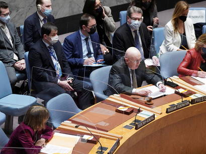 Russia's Ambassador to the UN, Vassily Nebenzia, takes his seat in the UN Security Council as it convenes for a crucial and uncommon emergency special session vote
