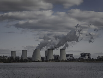 White smoke billowing from nuclear plants, greenhouse gas emissions, pollution, and the fossil fuel industry
