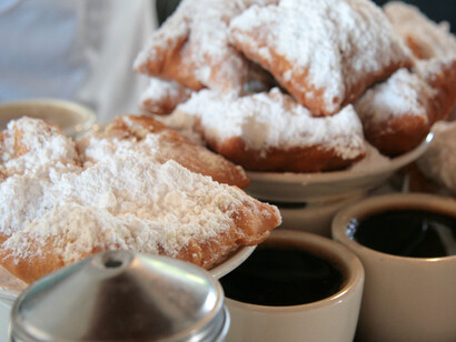 Beignets with sugar and coffee