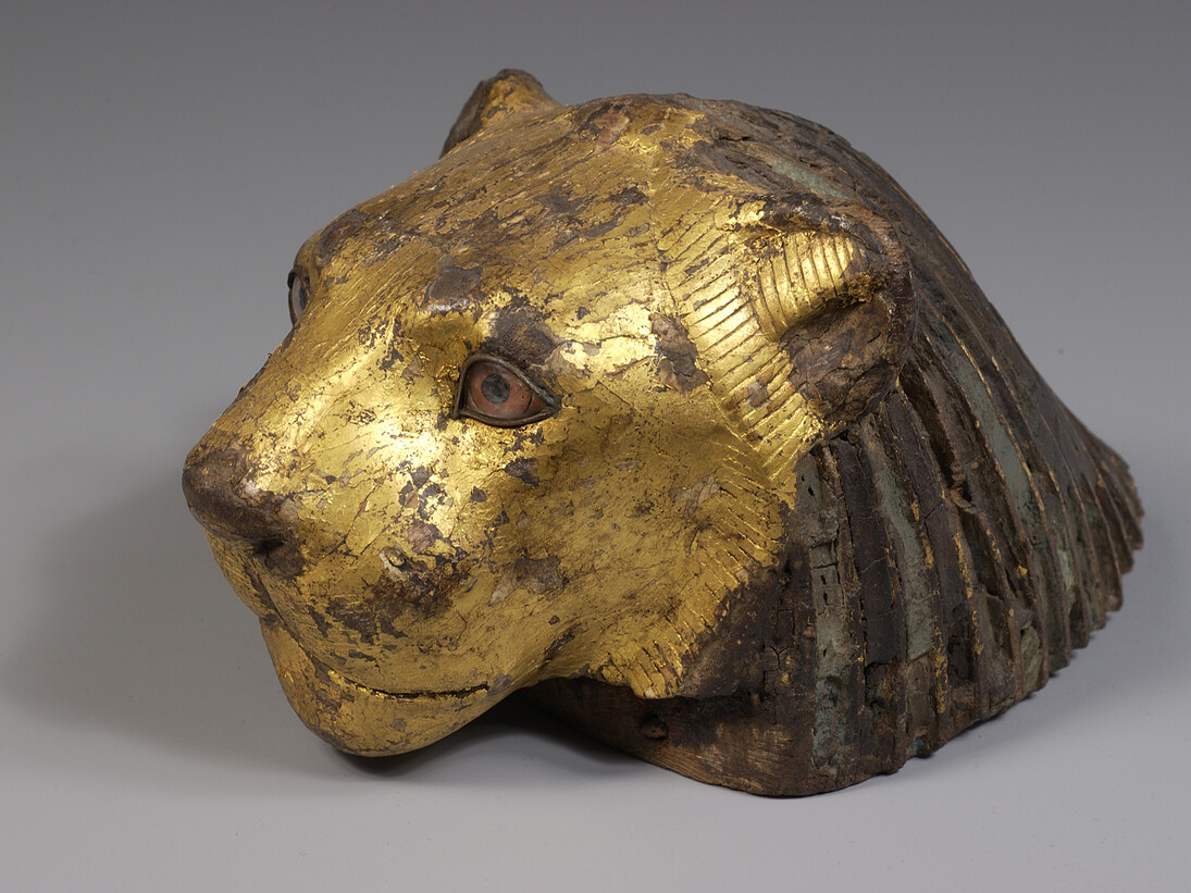 Piece of furniture in the form of a lion’s head Tamarisk wood, gold, glass, Late Period (664-332 BC) © Musée du Louvre, Dist. RMN-Grand Palais / Benjamin Soligny / Raphaël Chipault