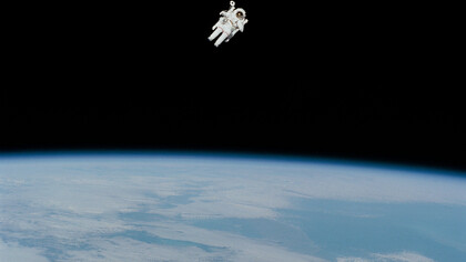 An astronaut floating on space with the Earth as background