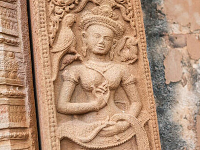 Carved stone relief depicting ancient Buddhist cosmology from Thailand