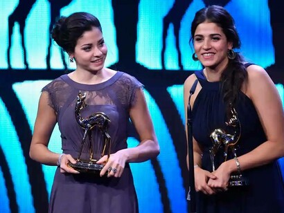 Yusra and Sarah Mardini (right) collect their Bambi awards at the stage theatre in Berlin, Germany, in 2016