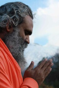 A man in deep mediation trying to channel and navigate the compassion he feels for himself and the world