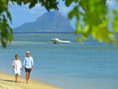 Blissfull walks on a sun drenched Mauritian beach