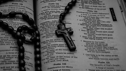 A Komboskini resting on a Bible, symbolizing faith and unceasing prayer
