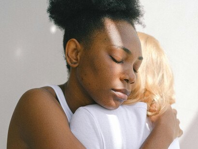 Close up of two women embracing each other