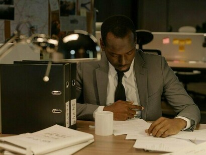 A man burdened by endless work, representing the silent struggle behind professional expectations