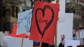 A placard with the word love written on it