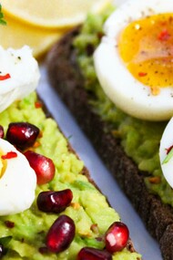 Sliced eggs served on savory cakes as part of a healthy meal