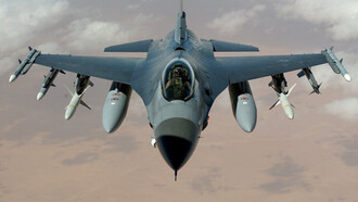 A jet plane soars through the skies