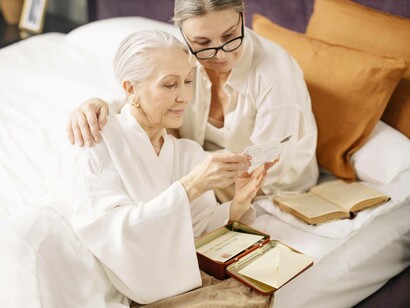 Grandma and her daughter looking at memories together