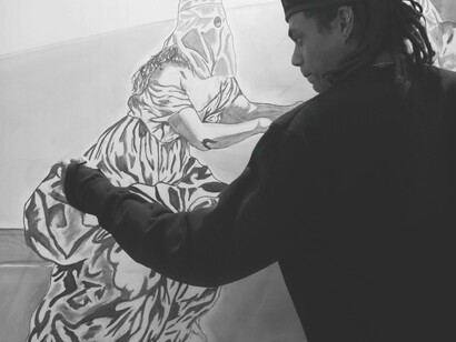 Tyrone Egbowon putting the finishing touches on his artwork