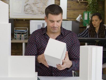 A team of architects studying a detailed 3D-printed replica of a business office, emphasizing the use of virtual construction tools, innovative 3D modeling techniques, and intelligent building management interfaces