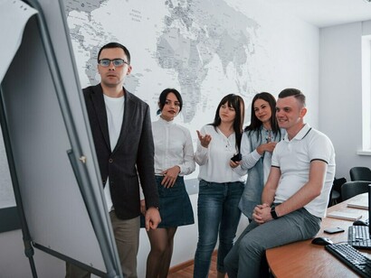 Business leaders and managers working together on international development projects, driving sustainable development through strategic development cooperation
