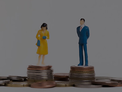 Financial equality: businessman and woman seated on equal piles of coins, empowering success