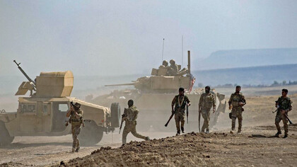 SDF soldiers stand guard at a frontline position in northeastern Syria, where the collapse of the Assad regime has reshaped the balance of power and exposed the Kurds to new vulnerabilities