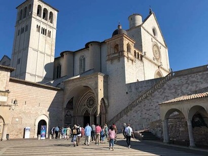 Jill Alexy’s pilgrimage group entering the Church of Saint Francis of Assisi (photo by Brenda Lee Bohen) 
