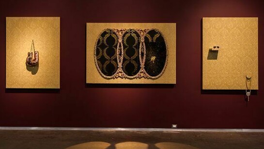 Carlos Rolon, My Father's Wishes (No. 1, No. 2, No. 3), 2014. Wallpaper, wood, mirror, 24 kt. gold leaf, quartz crystals, metal sunglasses and bronzed boxing gloves. No. 1: 50 x 64 inches, No. 2: 80 x 54 inches, No. 3: 50 x 64 inches. Image courtesy of the artist and Paul Kasmin Gallery.