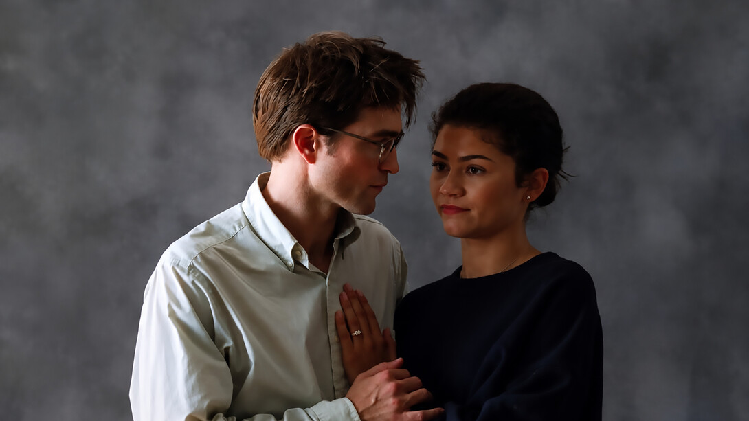 The Drama is a dark romantic comedy-thriller directed by Kristoffer Borgli that follows a young couple, Emma (Zendaya) and Charlie (Robert Pattinson), whose seemingly stable relationship descends into emotional turmoil one week before their wedding after a shocking confession about their pasts