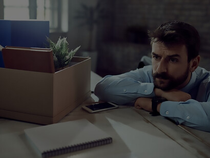 Young businessman feeling worried about his business and thinking of something in the office