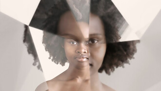 A black woman with prism kaleidoscope effect