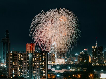 Ho Chi Minh City comes alive with a burst of light and color as fireworks illuminate the night, showcasing the city's energetic and vibrant character