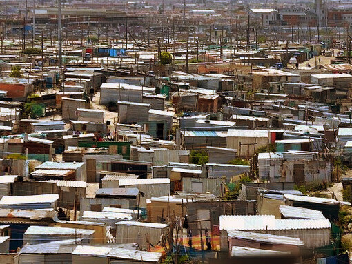 Despite strides towards economic empowerment, scenes of poverty in the township of Khayelitsha, in Cape Town, South Africa, serve as a sobering reminder of the ongoing battle against inequality, prompting reflection on the efficacy of policies like B-BBEE in truly uplifting marginalized communities