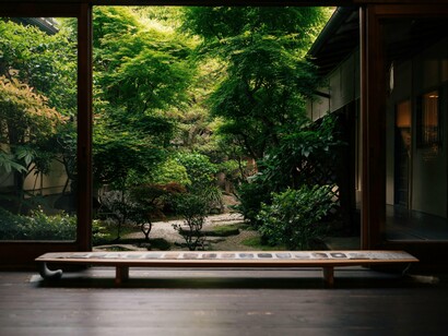 An open interior overlooking a secluded garden, reflecting the calm rhythm created through courtyard integration