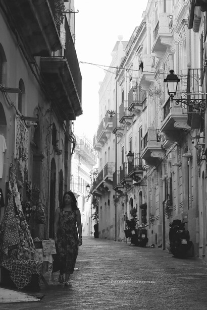 Monochrome urban street view showcasing the historic architecture of Palermo, Italy