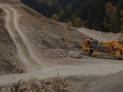 In Podkarpackie, Poland, the forest is disrupted as construction equipment paves the way for a new mine, resulting in the destruction of trees