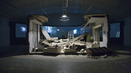 Zhang Peili, A Gust of Wind (Zeng feng) (2008). Five-Channel/five-screen video projection (PAL), silent/colour, 13’14” with objects preserved from the film set destroyed during shooting, dimensions variable. © Boers-Li Gallery, Beijing. Courtesy of the artist and Boers-Li Gallery