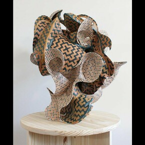 Austin Ballard, Perforator 5 (Maple Gathering in Square Repeat), 2024,
Cane webbing, epoxy clay, and textile dye, 28 x 23 x 26 inches. Courtesy of the artist and McKenzie Fine Art