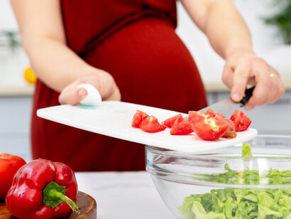 A pregnant woman enjoying a nutritious meal, supporting her baby's growth