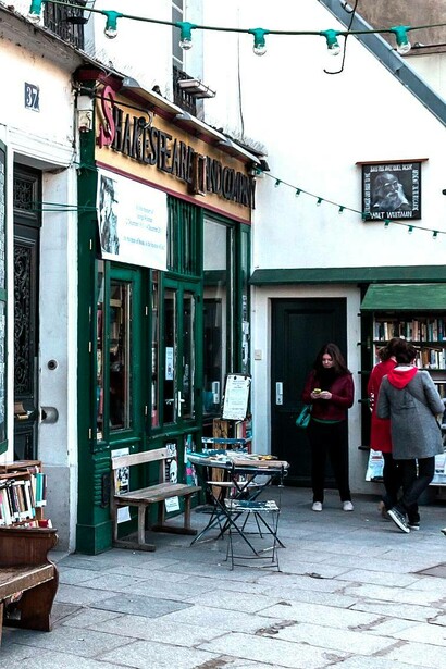 Customers loiter around Shakespeare and Company Bookstore, Paris, France