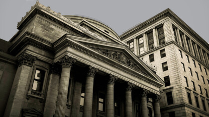 How do centralized politico-economic structures impact our standards of living?