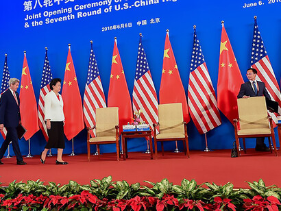 U.S. Secretary of State John Kerry walks between Chinese Vice Premier Liu Yandong and U.S. Treasury Secretary Jack Lew on June 6, 2016, as they enter in a villa at the Diaoyutai Guest House complex in Beijing, China