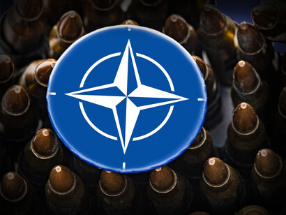 The NATO symbol surrounded by military bullets
