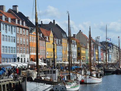 Nyhavn is a picturesque waterfront district in Copenhagen, Denmark, known for its colorful 17th-century townhouses, vibrant atmosphere, and charming canals.
