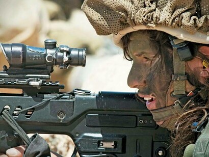 An Israeli sniper soldier in action