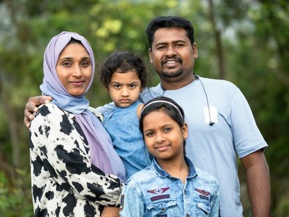 Happy migrant family posing together