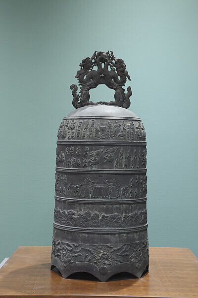 Ceremonial bell with imperial procession, landscape, and mythical creatures in waves, 12th century. Courtesy of the Metropolitan Museum of Art