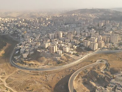 Discover the aerial separation of Israel and Palestine with a focus on the Security Wall, highlighting the Gaza Strip