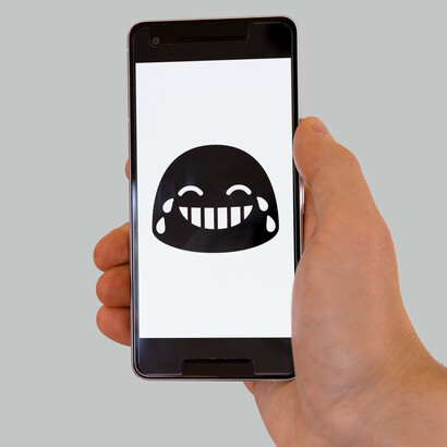 An emoji expressing laughter