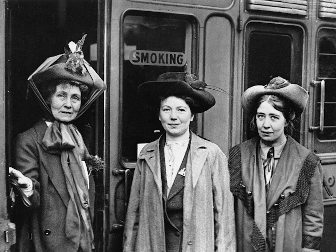 © IWM (Q 81490)
Emmeline Pankhurst (left) and her daughters Christabel (centre) and Sylvia (right) at Waterloo Station, London in 1911. All three were key figures in the women’s suffrage movement, which largely supported the British war effort in the First World War. However, some campaigners, including Sylvia Pankhurst, opposed the war.
 