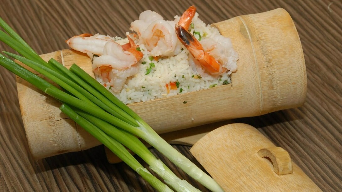 Prawns fried and rice served in bamboo custom